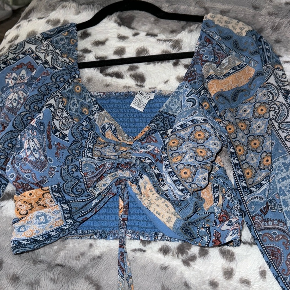 Blue dress up top long sleeve with patterns crop top fit. Western and dressy.